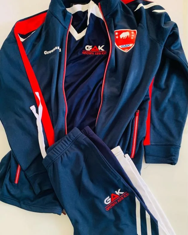 Navy and red GAK tracksuit with crest, jacket and pants flat lay